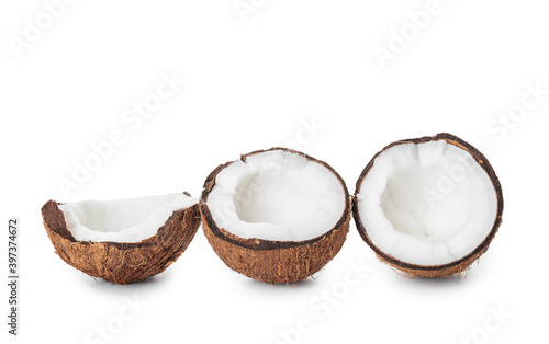 Halves of ripe coconut on white background