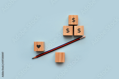 Εκτύπωση καμβά Wooden cubes in the form of scales with drawings of a heart and a money sign