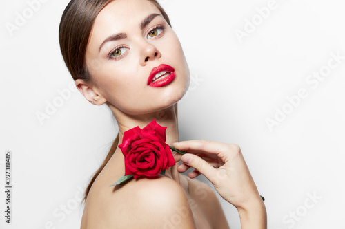 Brunette naked shoulders Red lips rose on the shoulders glamor attractive 