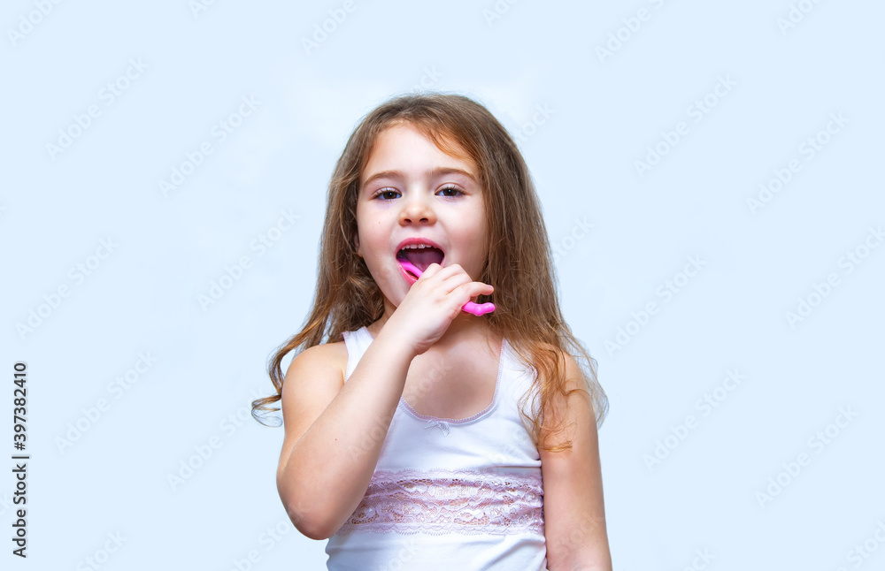 Portrait of a little girl brushing her teeth Portrait of a little girl brushing her teeth