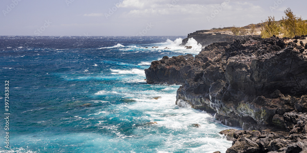 Panorama of the rocky coast of Reunion Island near Le Souffleur, a natural geyser in Piton Saint-Leu