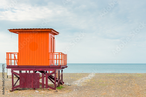 Lifeguard tower on a sandy beach in the early morning, no people © kosmos111