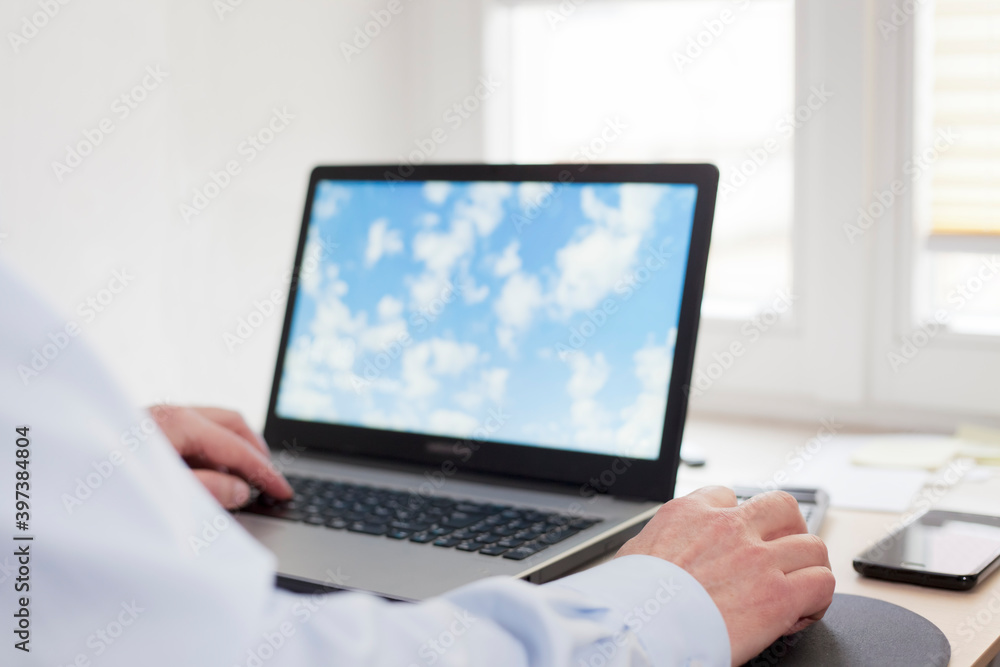 Businessman working remote at home with laptop Businessman working remote at home with laptop