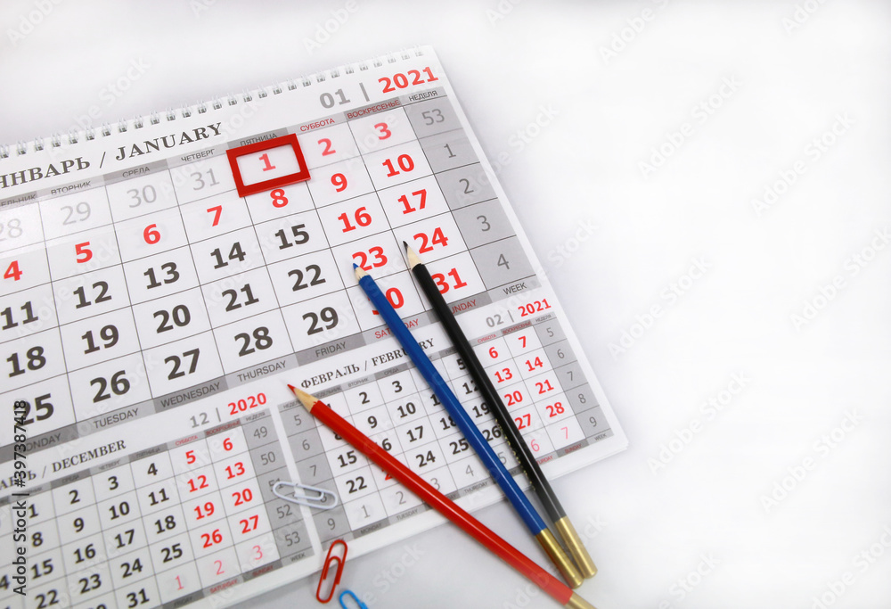 Colored pencils lying on a 2021 calendar page Colored pencils lying on a 2021 calendar page