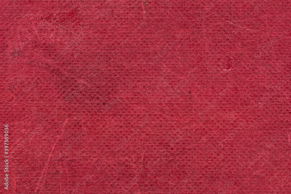 The texture of the old book cover is orange. Grunge background, worn vintage surface The texture of the old book cover is orange. Grunge background, worn vintage surface