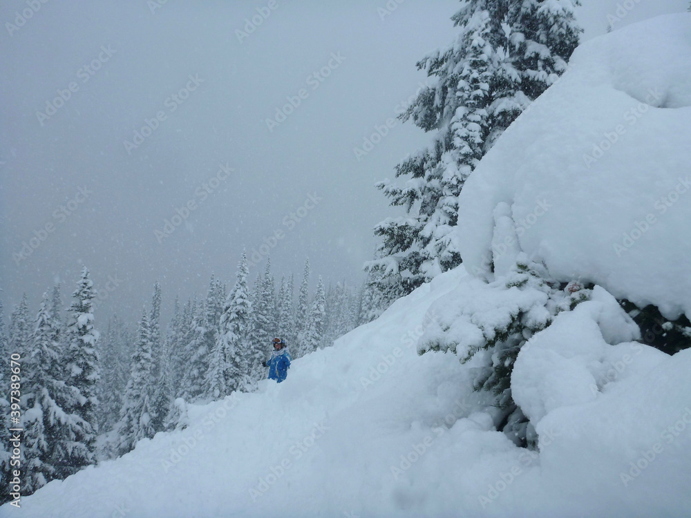 Fototapeta premium Snowboarder on the slopes of a ski resort after a storm