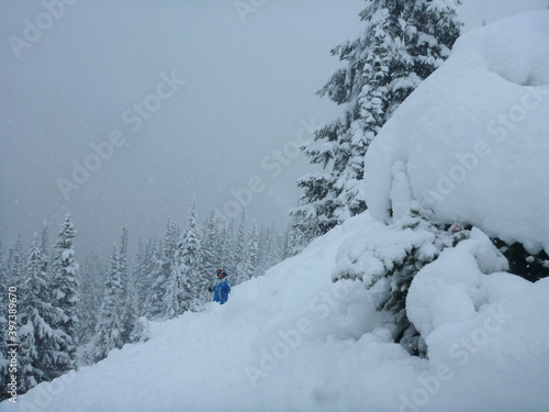 Snowboarder on the slopes of a ski resort after a storm