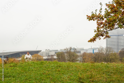 Lady is running in the city park as part of her daily exercise routine.