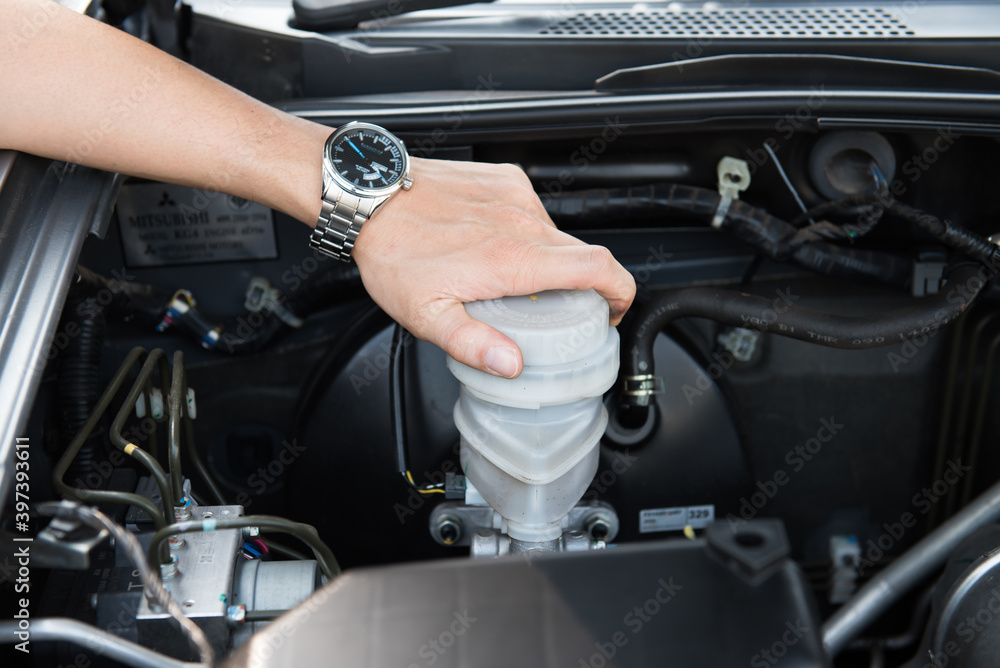 Obraz premium Hand shifting the gear stick,business man,driving car