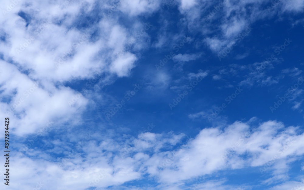 Blue sky background with clouds, White clouds floating on blue sky for backgrounds concept