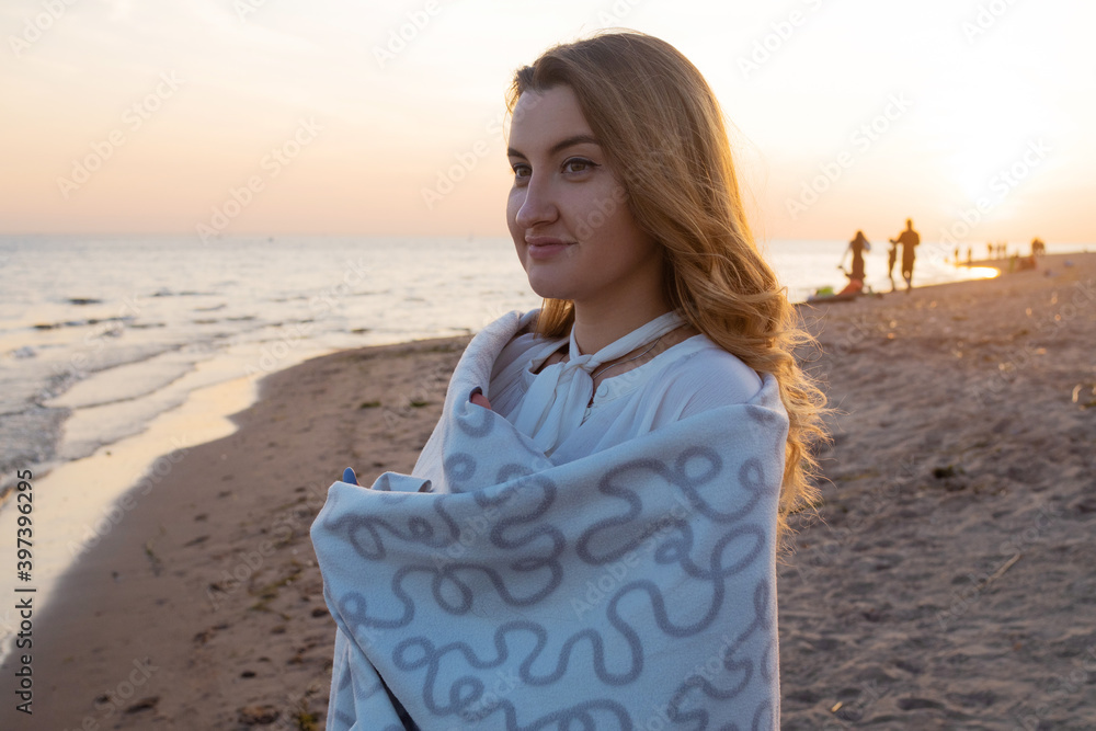 Young beautiful woman enjoying sunset on the beach, Young beautiful woman enjoying sunset on the beach,