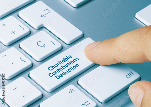 Charitable Contributions Deduction - Inscription on Blue Keyboard Key.