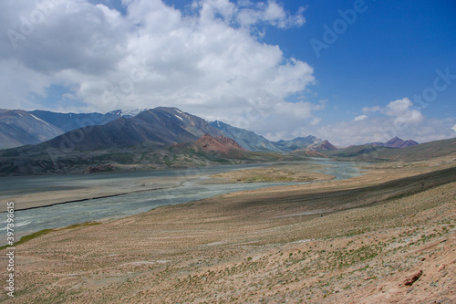 Stunning pastel colors of high-altitude mountain landscape along the Pamir Highway close to Kyzyl Art border in the high mountains of Gorno-Badakshan, Murghab district, Tajikistan