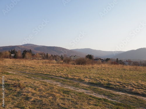 Scenic Silesian Beskid Mountains range in european Bielsko-Biala city at Silesian district in Poland, clear blue sky in 2020 warm sunny spring day on April.