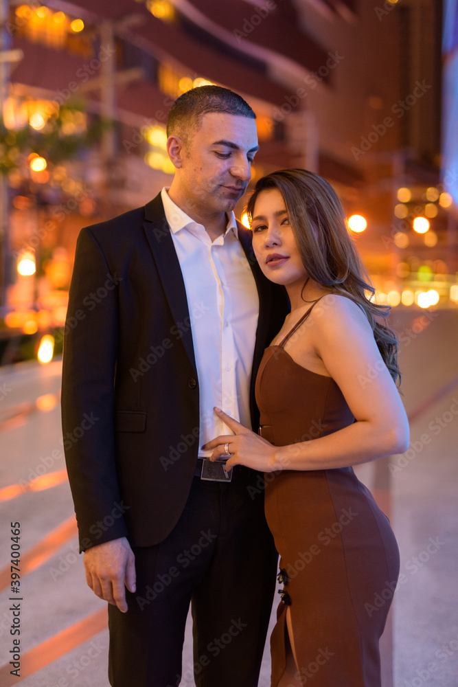 Portrait of couple outdoors at night in the city at Bangkok Thailand Portrait of couple outdoors at night in the city at Bangkok Thailand