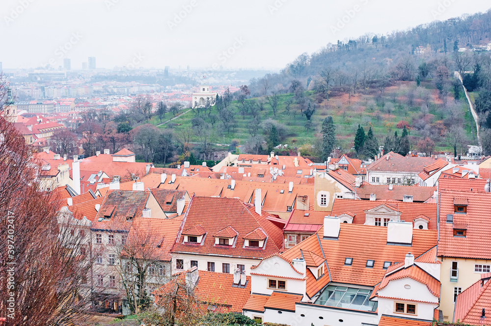 Obraz premium Travel and architecture. Cityscape with red tiled roofs view. Prague, Czech Republic.