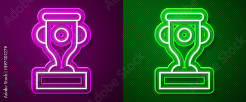 Glowing neon line Award cup icon isolated on purple and green background. Winner trophy symbol. Championship or competition trophy. Sports achievement sign. Vector.