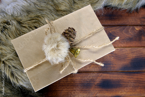 
Gift on wooden background. gift box with tag on wooden background. Gift box with ribbon on wood background with space / Vintage concept