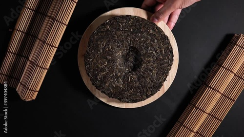 shen puer tea Close up top view. flat lay. place to copy text. on black background photo