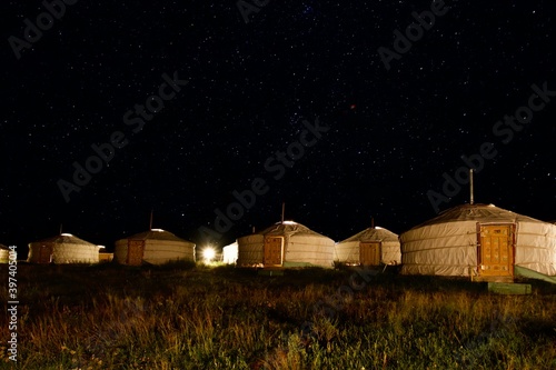 Starry sky over the gher camp (traditional Mongolian houses). Ugil lake, Mongolia.