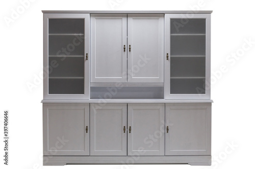 White kitchen cabinet with glass doors. Classical furniture made of natural wood. Modern luxury wooden kitchen isolated on a white background.