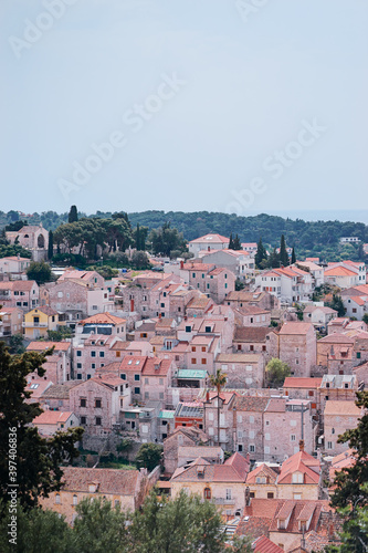 Beautiful cityscape with red tiled roofs of Hvar old town, Croatia. © luengo_ua
