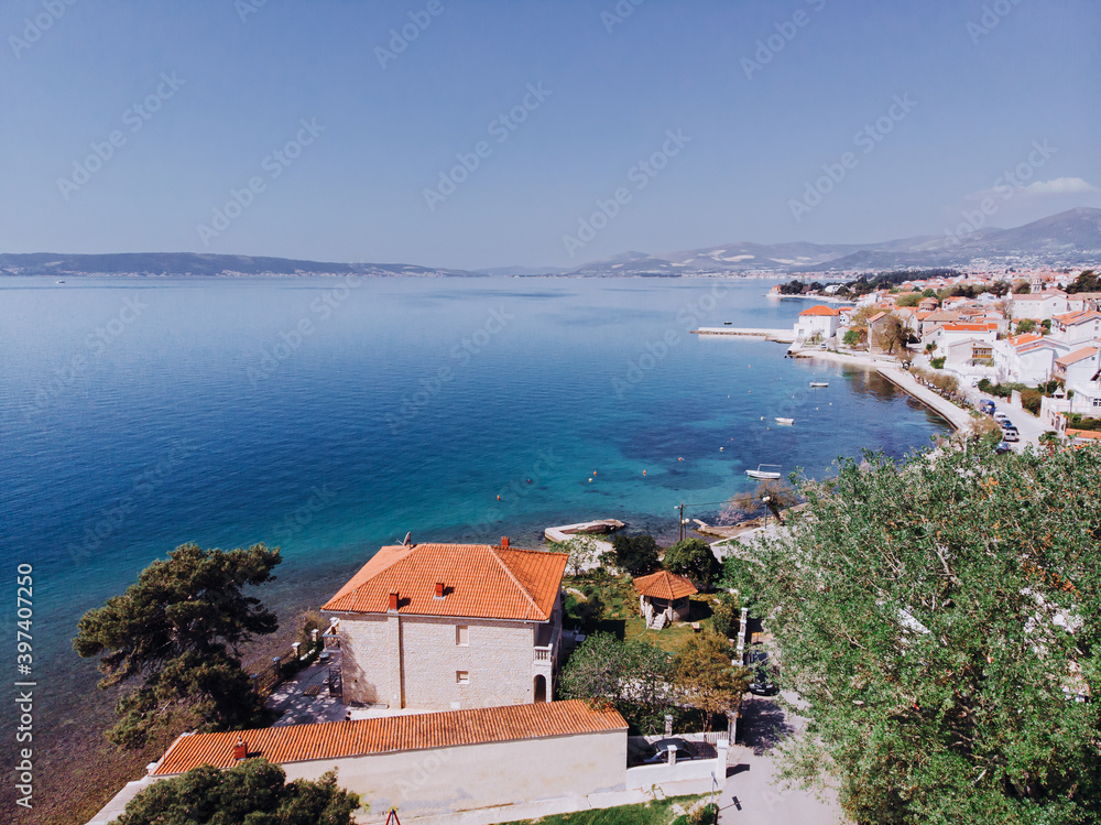Aerial shot of the Kastel coast in Dalmatia,Croatia . A famous tourist destination. Old town near on the Adriatic sea.