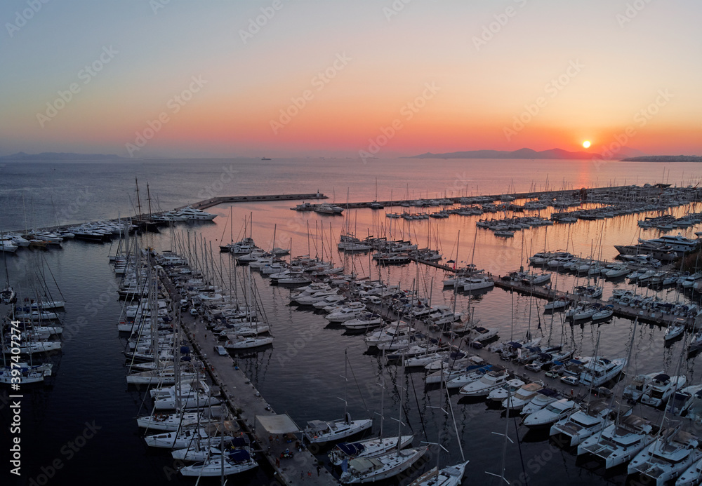 Aerial drone bird's eye view of marina in Athens with docked yachts.