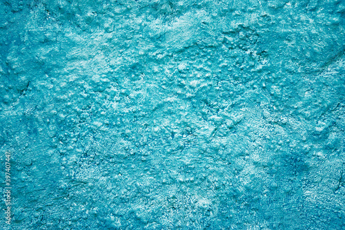 Textured backround. Blue painted wall.