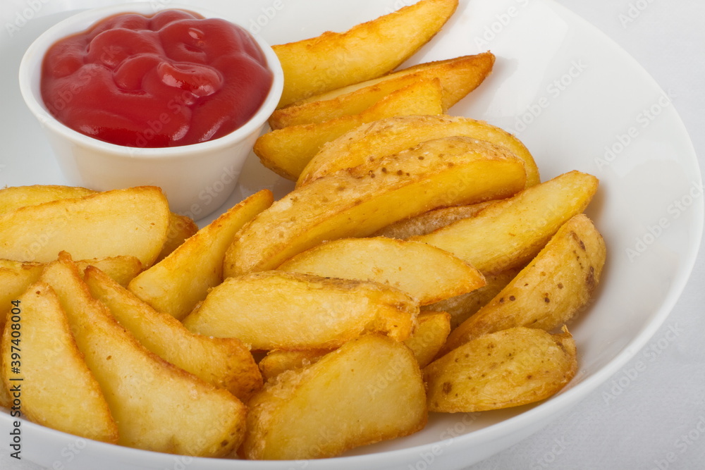 Fried potato slices with ketchup Fried potato slices with ketchup