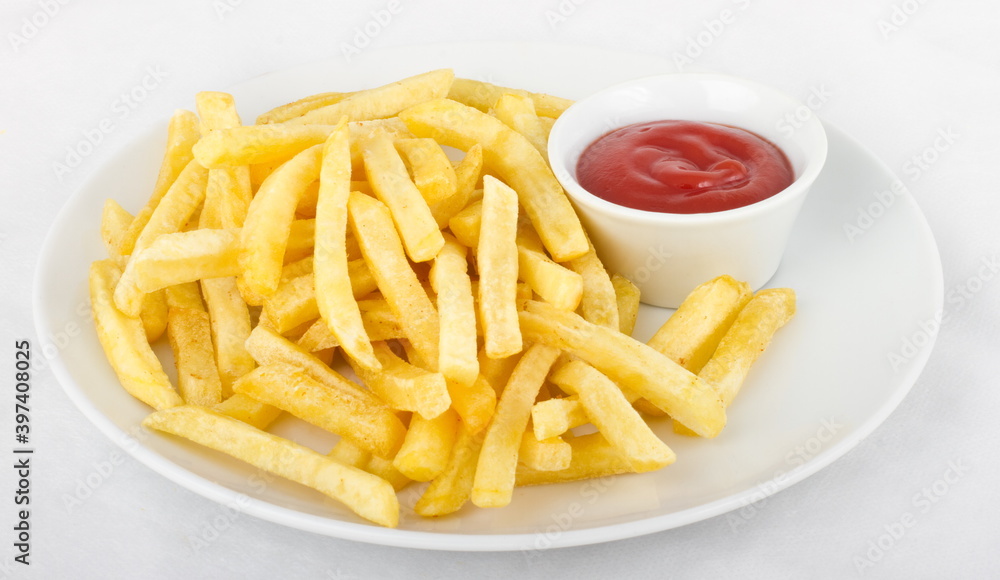 French fries with ketchup, served on a white plate French fries with ketchup, served on a white plate
