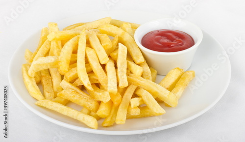 French fries with ketchup, served on a white plate