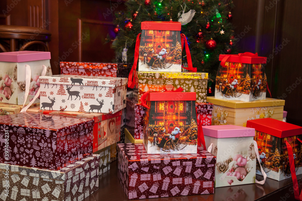 Fototapeta premium Christmas gifts under the tree. Gift boxes under the Christmas tree.