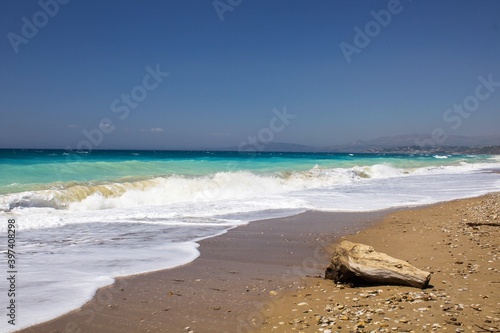 evocative image of a sandy beach with a sea of many colors and clear skies  © massimo