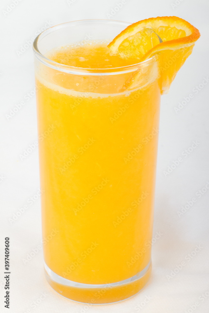 Fototapeta premium Freshly squeezed orange juice in a glass Cup