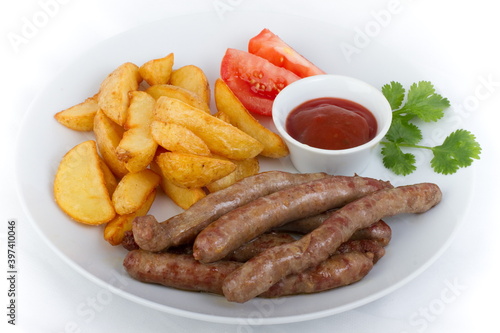French fried sausages with rustic potatoes and ketchup