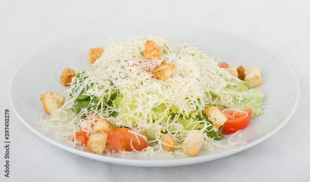 Classic Caesar salad on a white plate Classic Caesar salad on a white plate