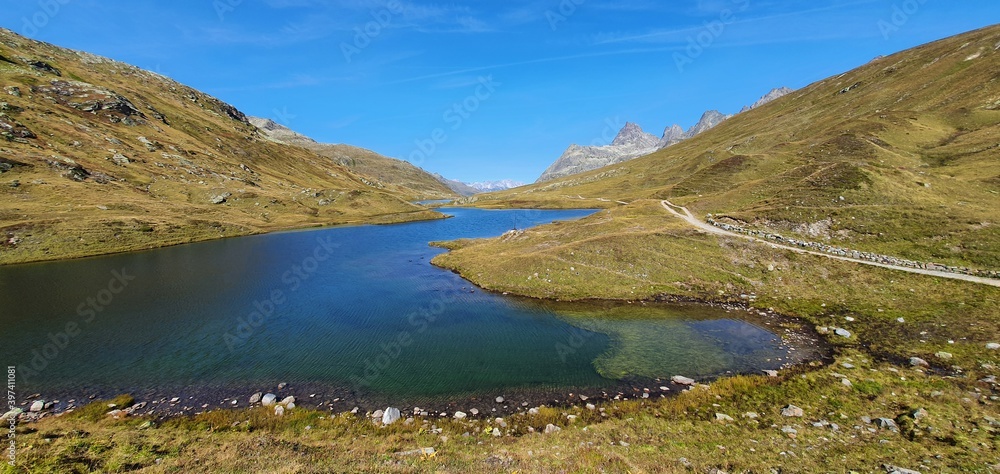 Aerial view of a mountain lake in the alps near ischgl in september 2020