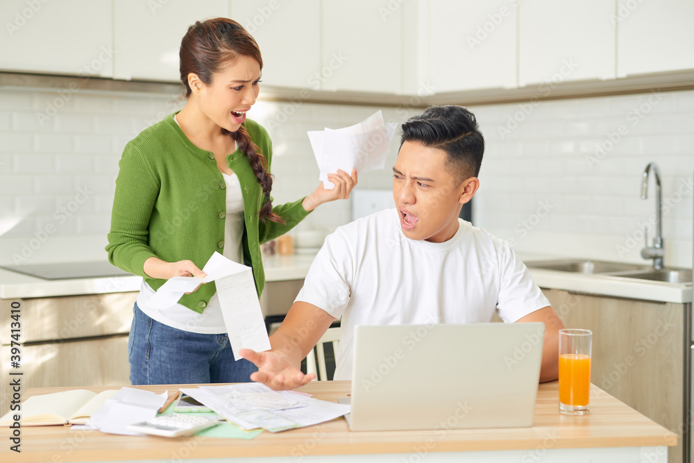 Woman and man arguing about money at home. Problems in relationship Woman and man arguing about money at home. Problems in relationship