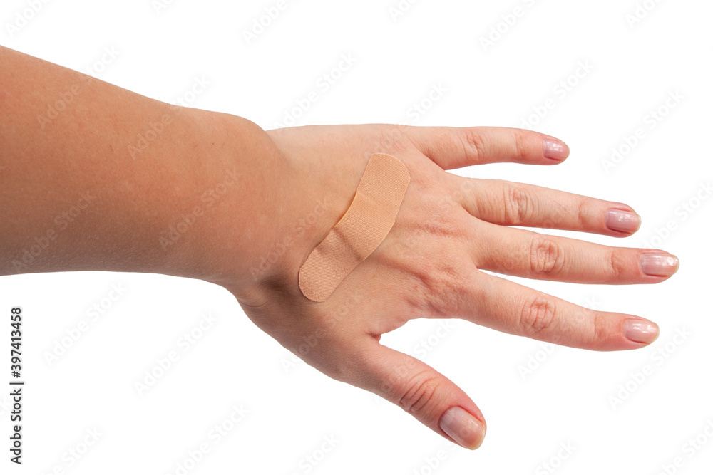 Medical patch plaster on hand isolated on the white Medical patch plaster on hand isolated on the white