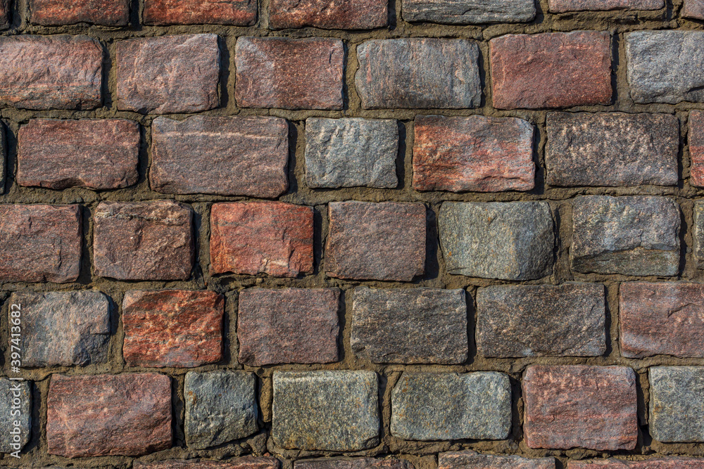 Obraz premium Fine masonry of short rectangular granite blocks, wall background