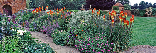 AN IMPRESS AND COLOURFUL PANORAMIC FLOWER BORDER photo