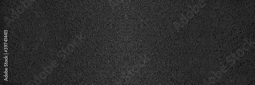 Surface texture of grey and black fresh asphalt pavement on street roads. Abstract panoramic background