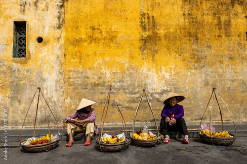Old Woman from Vietnam is selling fruits in the Streets of Hoi An	 photo