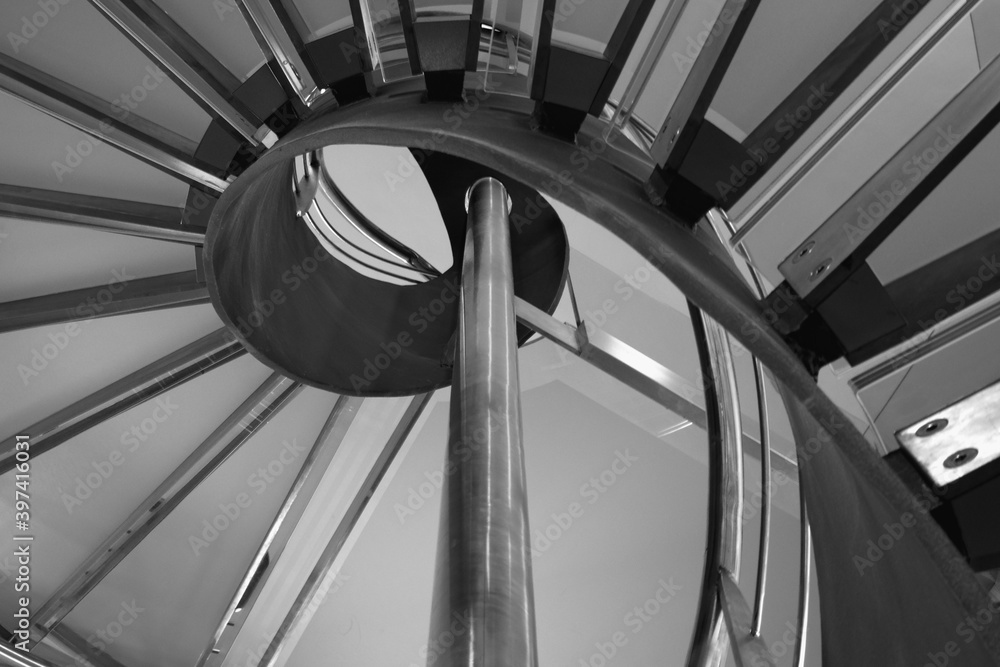 Fototapeta premium Detail of a spiral staircase made of aluminum and glass.