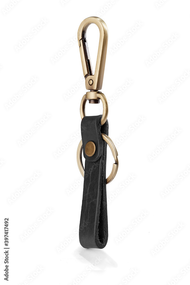 Detail shot of keychain with black leather belt loop, snap fastener, bronze rings and lobster clasp. The stylish keyring is isolated on the white background. Detail shot of keychain with black leather belt loop, snap fastener, bronze rings and lobster clasp. The stylish keyring is isolated on the white background.