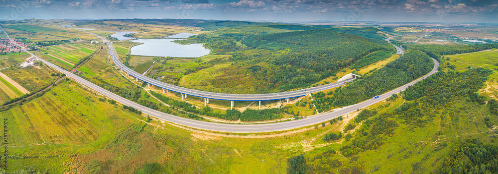 Aerial view of A1 Transylvania Highway between Sibiu and Sebes with spectacular viaduct bridge and passage route, roads of Romania