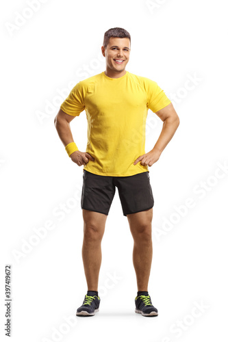 Full length portrait of a smiling man in sportswear
