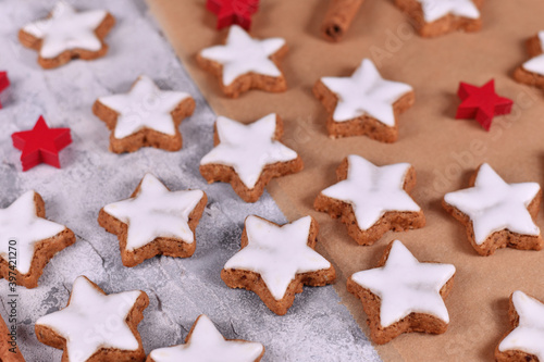 German star shaped glazed Christmas cookies called 'Zimtsterne' made with amonds, egg white, sugar, cinnamon and flour