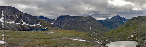 cold lakes among gray rocks in the mountains on a cloudy day